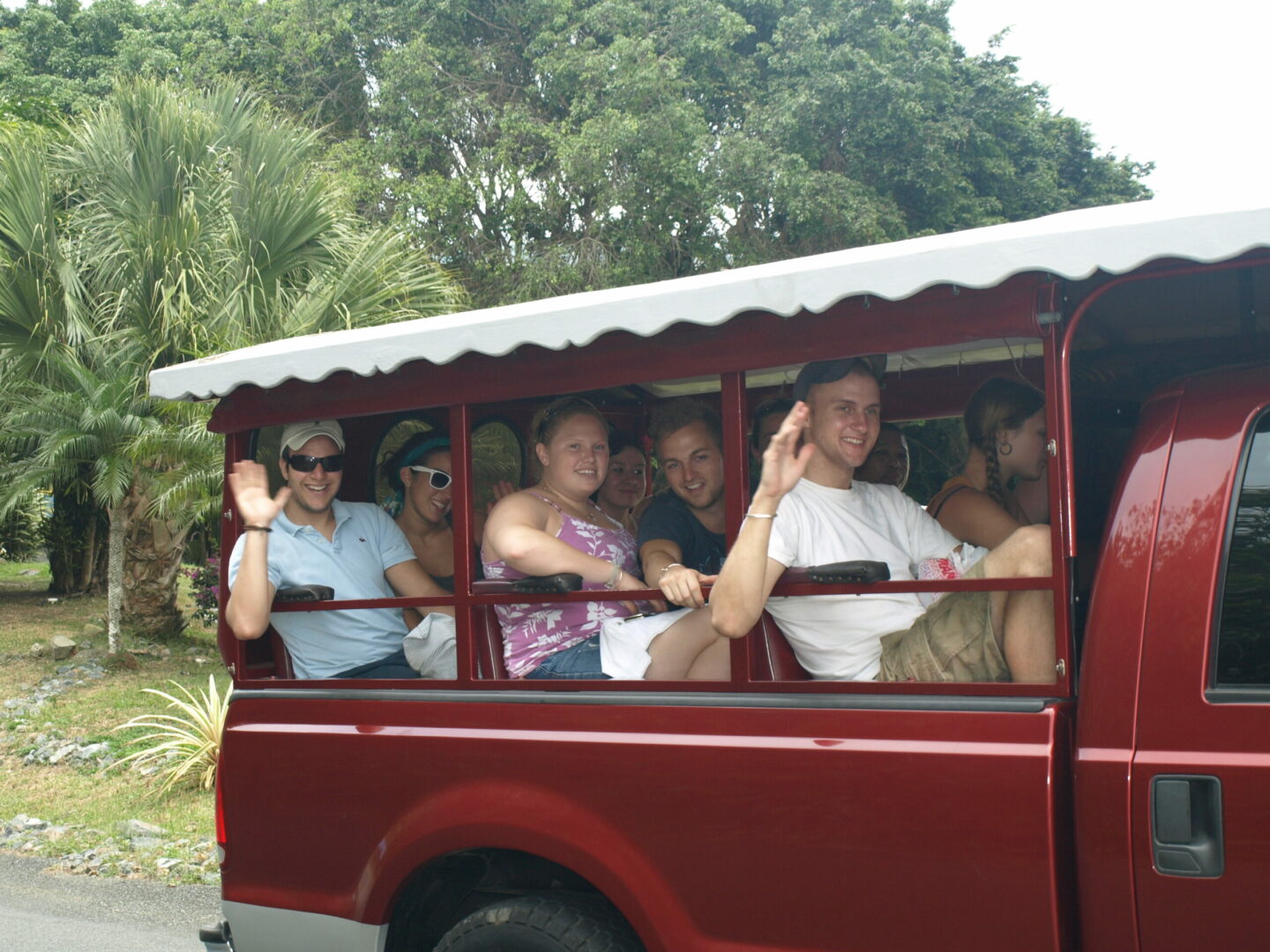 A group of people riding in the back of a bus.