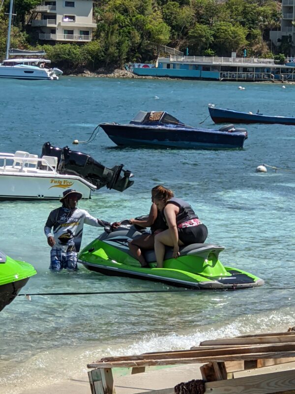 A man on a jet ski in the water.