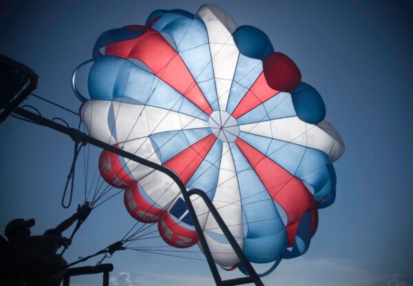 A parachute is shown with the sky in the background.